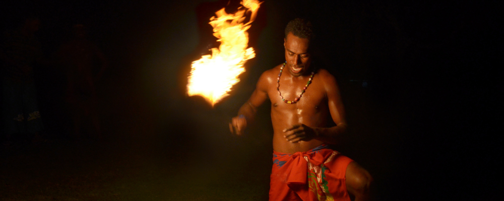 Traditional fire dancer at night