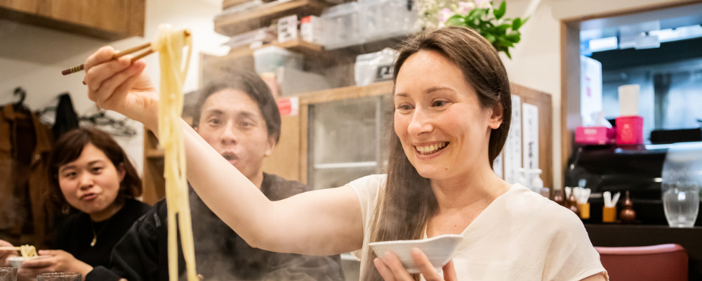 Woman eating noodles