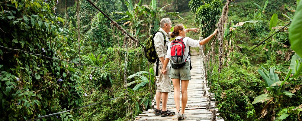 Couple on bridge in jungle