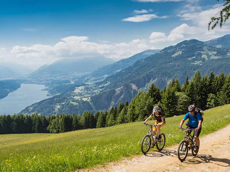 Two people cycling in Austrian countryside