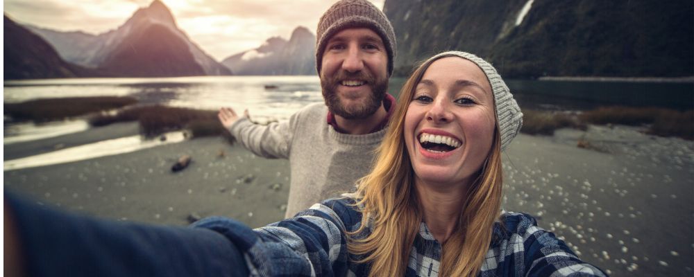 Couple taking selfie on beach 