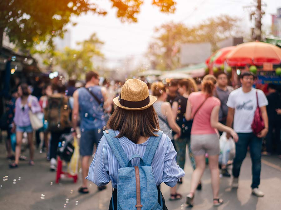 Woman walking through crowd