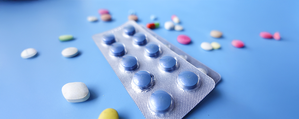 Pill pack surrounded by pills