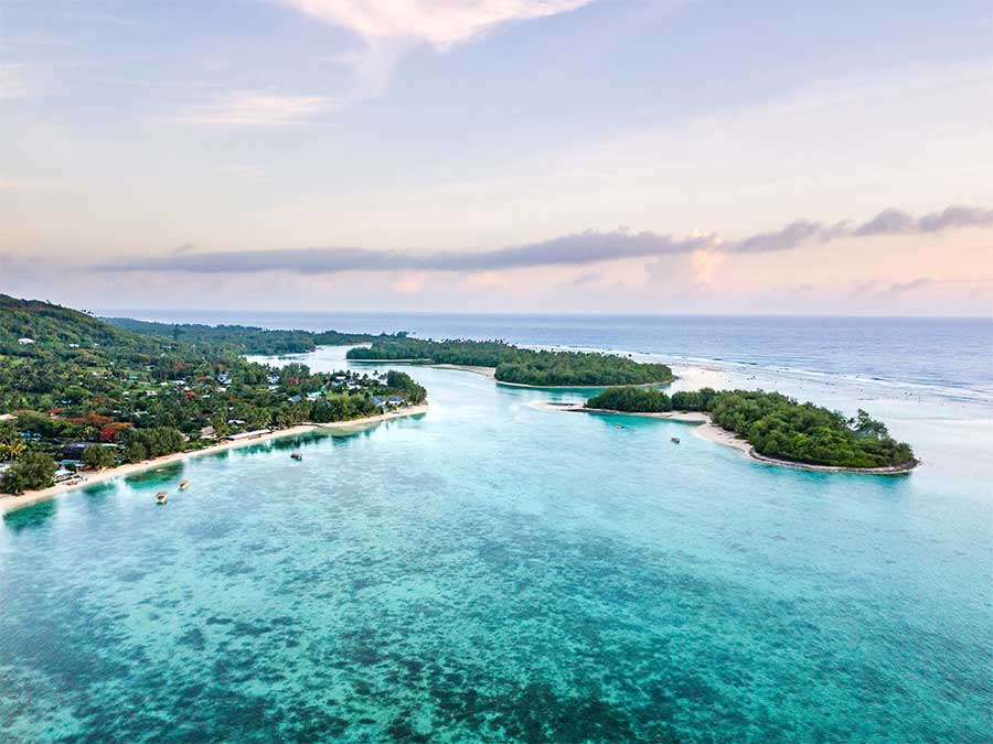 An aerial view of Muri Lagoon at sunrise in Rarotonga in the Cook Islands