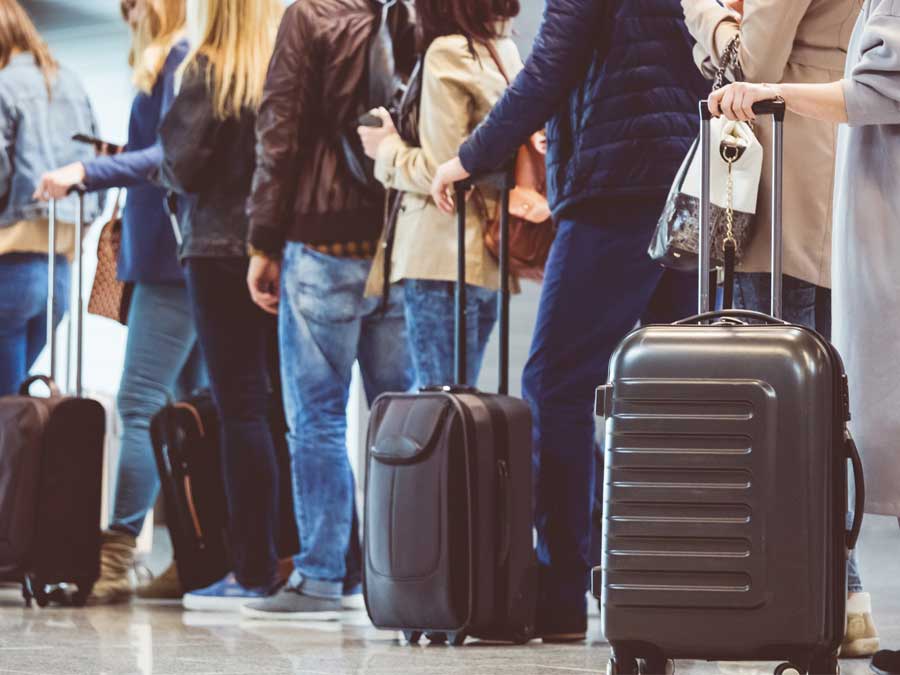 Passengers waiting with their luggage